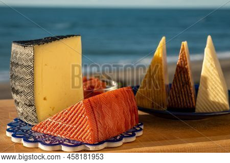 Assortment Of Spanish Hard Cheeses, Curado, Manchego, Goat Cheese Served Outdoor With Membrillo Jam
