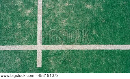 Top View Of Line On Floor And Part Of Green Synthetic Grass Paddle Tennis Court