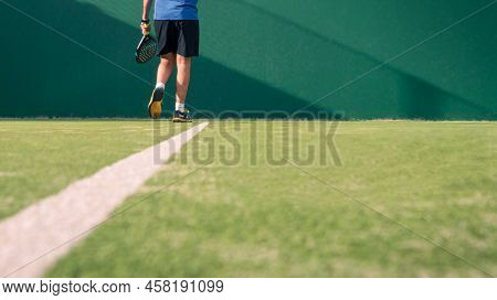 Monitor Practicing Paddle Sport On The Outdoor Court. Man Teaching Padel Class