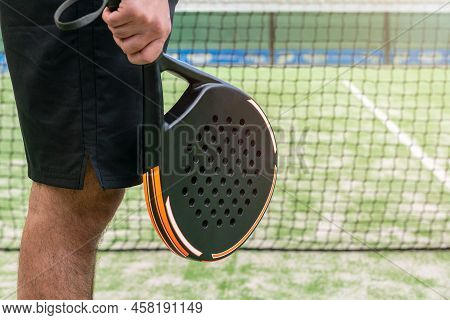 Professional Monitor Of Padel Holding A Black Racket. Racquet Sport Game Concept