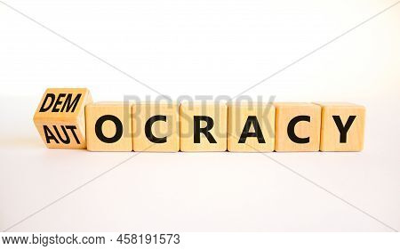 Democracy Or Autocracy Symbol. Turned Wooden Cubes And Changed The Concept Word Autocracy To Democra