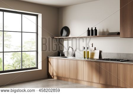 Corner View On Bright Kitchen Room Interior With Cupboard, White Wall, Concrete Floor, Panoramic Win