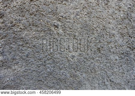Dusty Wall With Coarse Dark Gray Roughcast Finish