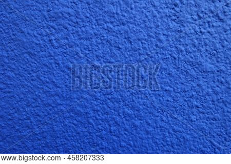 New Wall With Coarse Vibrant Blue Roughcast Finish