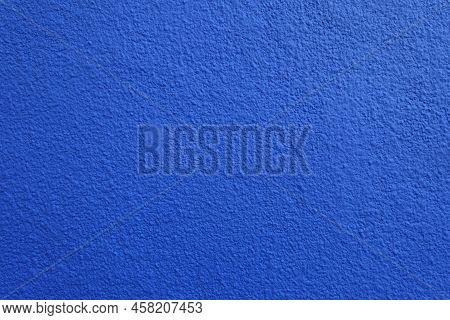 Texture Of Wall With Coarse Vibrant Blue Roughcast Finish