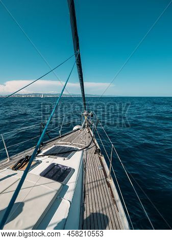 View From Yacht Prow Heading In Mediterranean Sea With Deep Blue Water In Summer, Barcelona, Spain