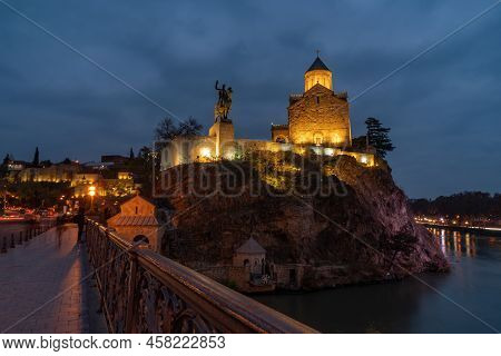 Tbilisi, Georgia - 14 November, 2021: Night Illuminated View Of The Metekhi Church And The Equestria