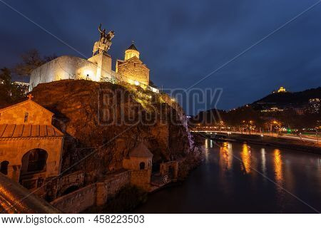 Tbilisi, Georgia - 14 November, 2021: Night Illuminated View Of The Metekhi Church And The Equestria