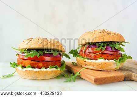 Health, Plant Based Meatless Burgers Of Chickpeas And Sweet Potato. Side View Scene Against A White 