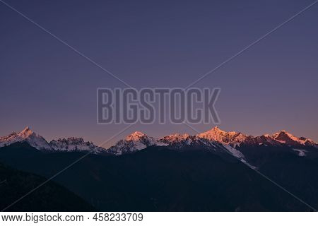 Kawabego Peak Of The Meili Snow Mountain At Sunrise In Yunnan Province, China