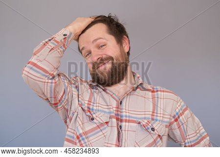 Proud Mature Caucasian Man With Beard Being Satisfied With His Job Results
