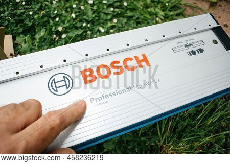 Paris, France - Apr 29, 2022: Garden View Pov Male Hand Pointing At The Bosch Professional Guide Rai