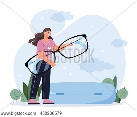 Ophthalmology And Medicine. Young Smiling Female Doctor Holds Eyeglasses With Corrective Lenses For 