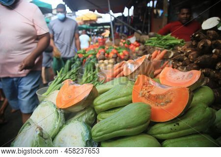 Salvador, Bahia, Brazil - April 30, 2022: Pumpkin Chucho And Vegetables On Sale At The Sao Joaquim F