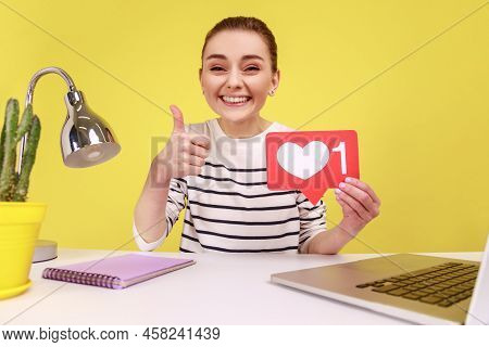 Excited Woman Making Point Of View Photo For Subscribers While Sitting At Workplace, Broadcasting Li
