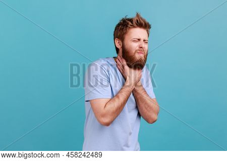 Portrait Of Bearded Man Grimacing Touching His Neck, Feeling Pain While Swallowing, Sore Throat, Ris