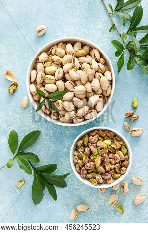 Pistachios. Whole Pistachios With Green Leaves And Pistachio Nut Kernels. Healthy Natural Vegetarian