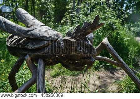 The Concept Of Travel In Russia. Kivach Nature Reserve In Karelia. Sculpture Of Handmade Mosquito In