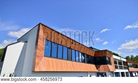 Office Building With White Aluminum Composite Panels. Facade Wall Made Of Glass And Metal. Abstract 