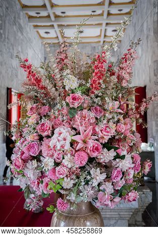 Big Bouquet Of Flowers In A Vase On A Gray Wall Background