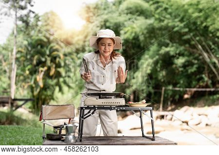 Young Aisan Girl Grilling Barbecue In The Campground At Summer Camp Travel, Skewers Of Pork And Beef