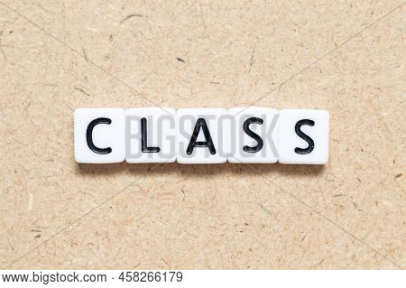 White Tile Alphabet Letter With Word Class On Wood Background