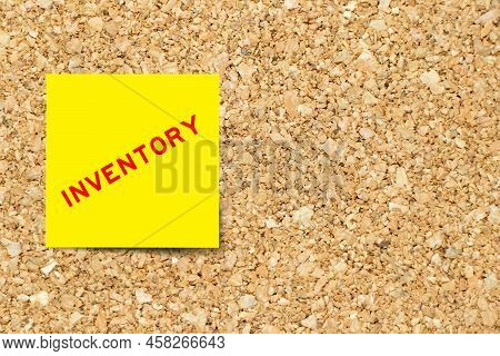 Yellow Note Paper With Word Inventory On Cork Board Background With Copy Space