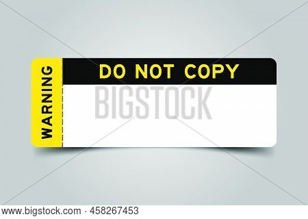 Yellow And Black Color Ticket With Word Warning And Do Not Copy And Have White Copy Psace On Gray Ba