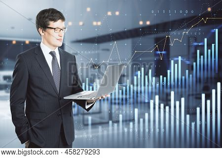 Attractive Thoughtful Young European Businessman Using Laptop With Abstract Glowing And Growing Busi