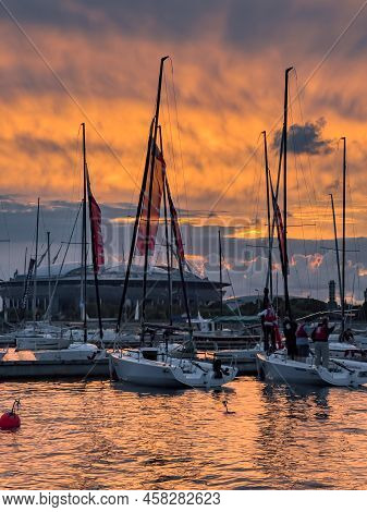 Russia, St. Petersburg, 12 July 2022: The Yacht Club With Piers And Sailing Boats Against The Backdr