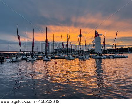 Russia, St. Petersburg, 12 July 2022: The Yacht Club With Piers And Sailing Boats Against The Backdr