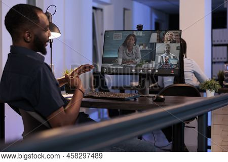 Executive Manager Meeting With Team Of People On Online Videocall With Webcam And Computer. Talking 