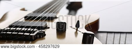 Close-up Of Classic Shape Wooden Electric Guitar With Rosewood Neck. Six Stringed Learning Lesson Mu