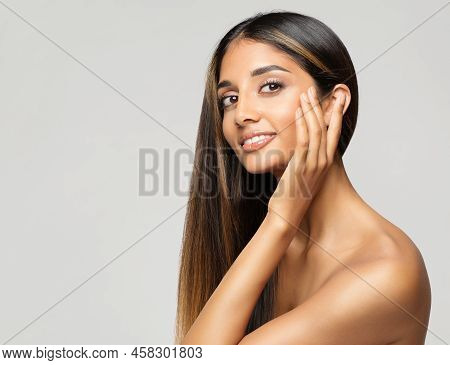 Young Woman Face Portrait. Beauty Model Touching Cheekbones. Women Facial Skin Care And Facelift Tre