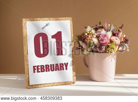 February 1. 1th Day Of Month, Calendar Date.bouquet Of Dead Wood In Pink Mug On Desktop.cork Board W