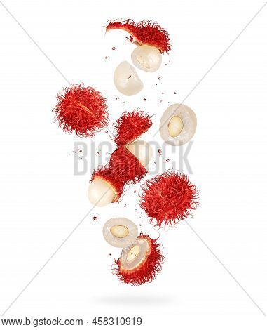 Whole And Crushed Rambutan Fruits In The Air, Isolated On A White Background