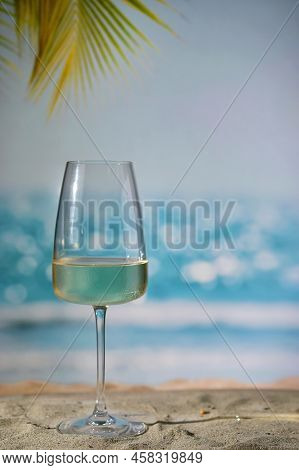 Closeup Summer White Wine Glass On Sand Beach