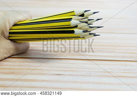 Wooden 2b Pencils Lying On Red Note Book On Wooden Desk. Copy Space.