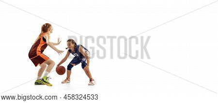 Play Defense. Two Basketball Players, Young Girls, Teen Training With Basketball Ball Isolated On Wh