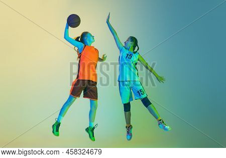 Attack And Defense. Female Basketball Players, Young Girls, Teen In Action With Basketball Ball Isol