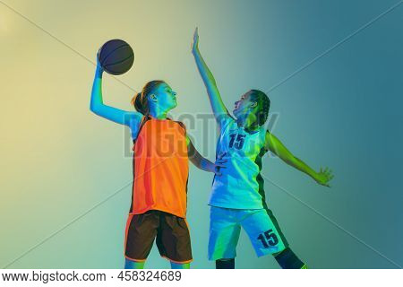 Attack And Defense. Female Basketball Players, Young Girls, Teen In Action With Basketball Ball Isol