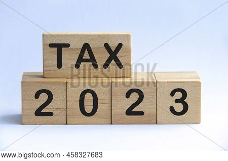 Tax 2023 Text On Wooden Blocks With White Background. 2023 Tax Concept