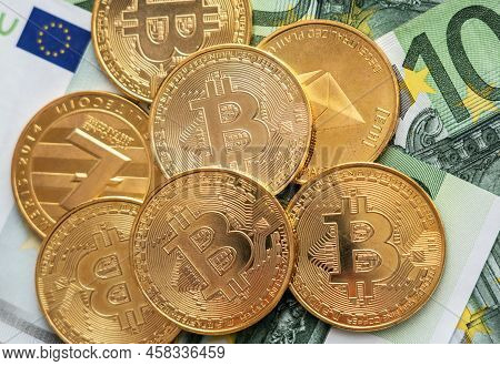 Bitcoin Coins Cryptocurrency And Euro Banknotes, Financial Background.