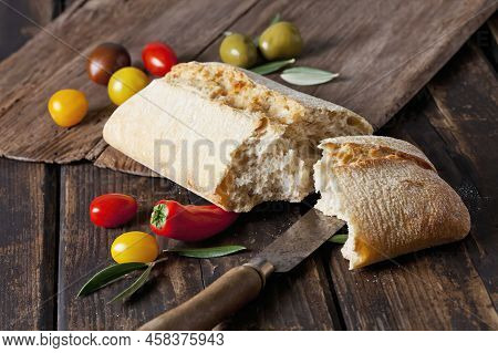 Ciabatta Bread With Tomatoes, Mini Ciabatta Bread With Green Olives In Bowl, Tomatoes And Mini Capsi