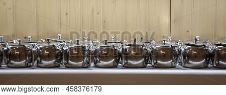 Many Coffee Pots Stand Side By Side In One Compartment.