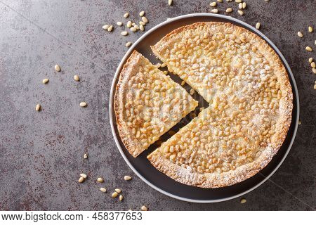Italian Cake Covered With Pine Nuts Known As Torta Della Nonna Closeup In The Plate On The Table. Ho