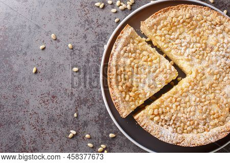 Torta Della Nonna A Soft Flat Italian Cake Flavoured With Pine Nuts Closeup In The Plate On The Tabl