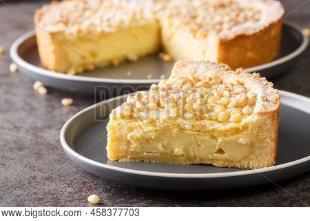 Torta Della Nonna A Soft Flat Italian Cake Flavoured With Pine Nuts Closeup In The Plate On The Tabl