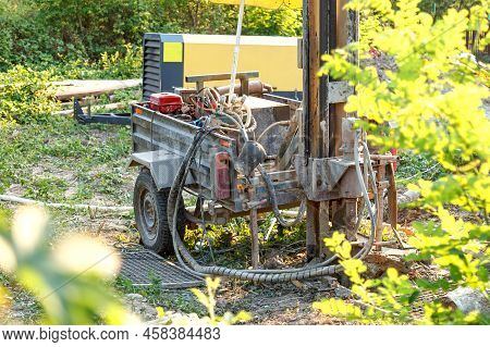 Rotary Drilling Rig At A Construction Site.sludge Flow From The Joule During The Water Well Drilling