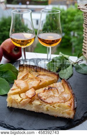 Tasting Of Fresh Baked Apple Cake And Strong Alcoholic Drink Calvados Made From Apples In Normandy A
